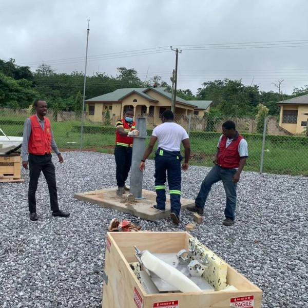 Technical team preparing satellite ground-station equipment